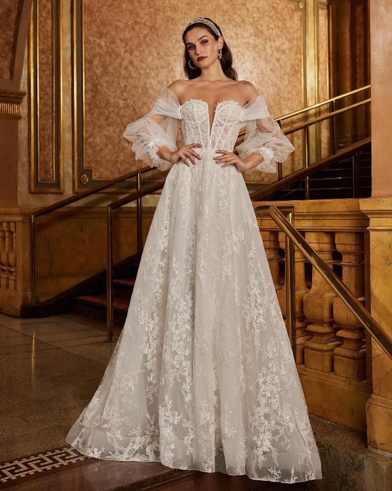 122107 long sleeve sparkly wedding dress with long train and a line silhouette3
